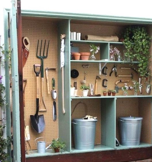 garden tool storage ideas using a peg board to create unique space for each item